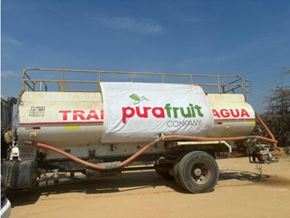 Griffin and Brand - White Purafruit-branded lorry trailer in a yard - Sustainability & Responsibility